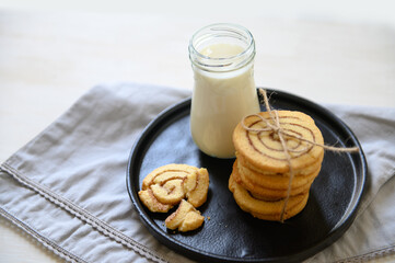 Shortbread cookies with cinnamon and a glass of milk. Selective focus.