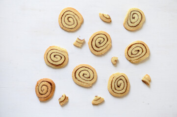 Shortbread cookies with cinnamon on a white wooden background. Cookie pattern. Selective focus.