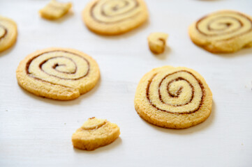 Obraz na płótnie Canvas Shortbread cookies with cinnamon on a white wooden background. Cookie pattern. Selective focus.