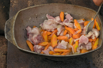 Pilaf in a cauldron with spoon