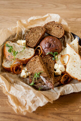 Bread plate Slicing bread. Black and brown bread in a basket