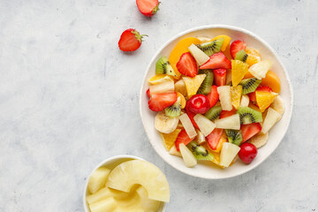 Fresh chopped fruit salad in a bowl. Top view.