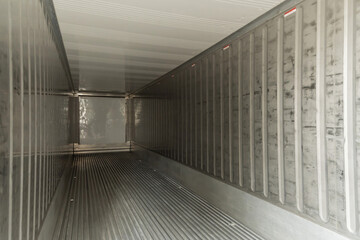 empty interior shipping cargo container for transportation shipping and logistic with copy space at container cargo harbor, industrial, delivery service, logistics import and export business concept