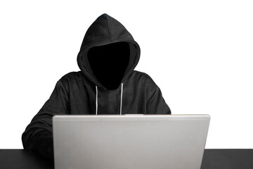 Unknown hacker working with laptop on table