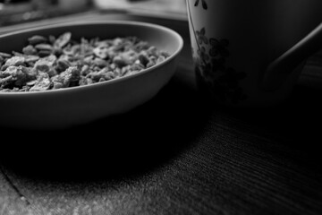 Indian Garam masala powder in bowl and it's ingredients colourful spices. Served over moody background. selective focus