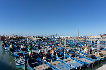 Fototapeta na wymiar Blue boats at Essaouira port in Morocco.