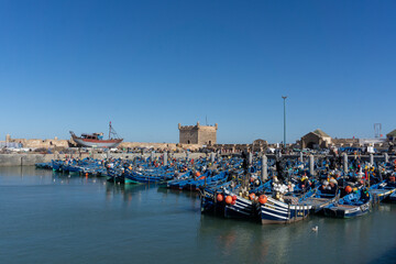 Fototapeta na wymiar Blue boats at Essaouira port in Morocco.