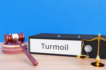 Turmoil. File Folder with labeling, gavel and libra. Law, judgement, lawyer