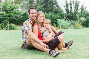 Happy young family in garden, Germany