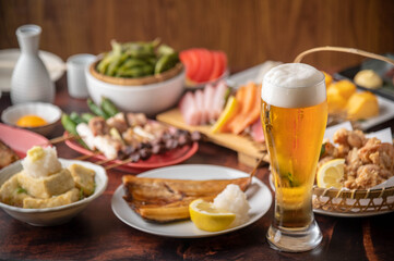 Fototapeta na wymiar japanese izakaya styke restaurant food with beer