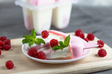 Ice cream background in cups. Fresh ice cream for dessert. Raspberry and mint. View from above. Copyspace