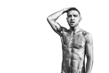 Handsome, attractive, muscular man in shower on a white background. Skin care, washing. Isolated