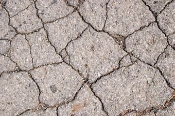 Cracked asphalt texture. Abstract asphalt background