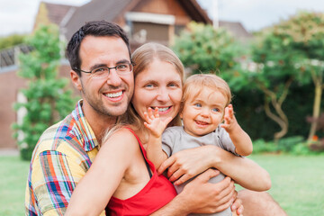 Happy young family in garden