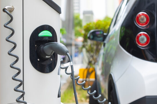Electric car charging station at street level in Singapore, Southeast Asia.