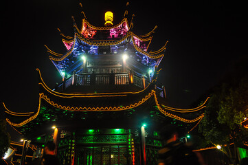 Fototapeta premium Pagoda adorned with colorful lights at night. Suzhou, China.