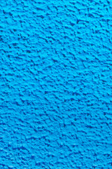 Textured surface coat plaster walls blue color.	