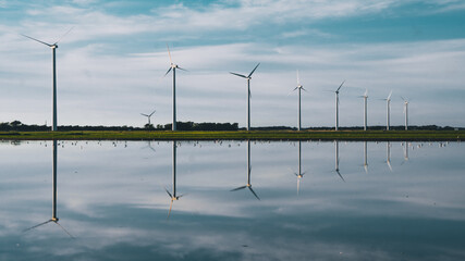 Fototapeta premium Reflective windmills - The netherlands