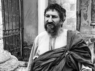 Actor in the guise of an ancient Greek philosopher on the set.