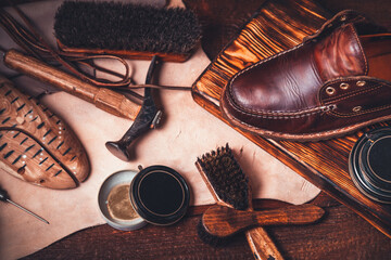 Shoe repair and cleaning shop, table with accessories for boots care