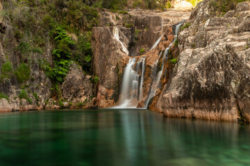 Naklejka na ściany i meble Amazing waterfall in the Peneda Gêres National Park , Terras de Bouro , Portugal