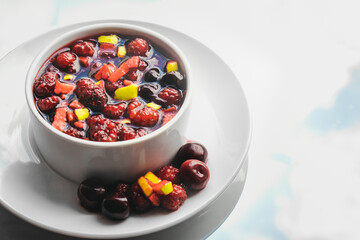 Fruit salad and juice on sky background. Healthy breakfast concept.