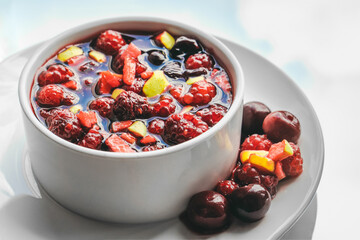 Fruit salad and juice on sky background. Healthy breakfast concept.