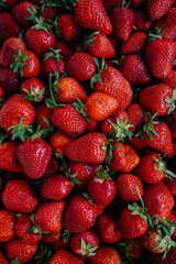 Ripe fresh strawberries close-up in a container for sale. Healthy diet