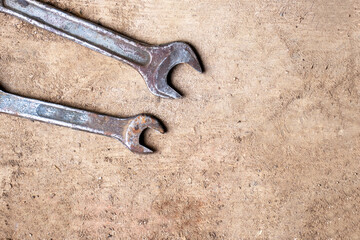 Spanner on a brown background. Copy space for design.