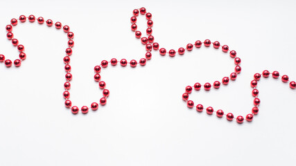 red Christmas chain on a white background. space for text. 