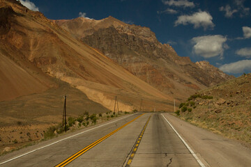 Transport. Desert road. View of the asphalt highway across the valley and mountains.	
