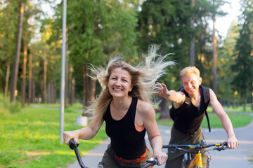 Happy couple on bikes in the park