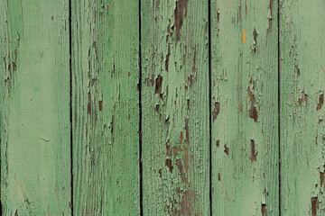Fototapeta na wymiar background green boards Several of planks painted in green. Fragment of the fence.
