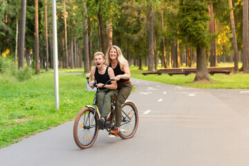 Happy couple on bikes in the park