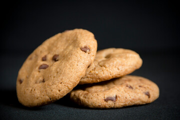 Chocolate chips cookies in a black background