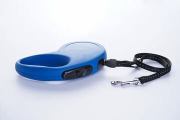Blue retractable dog leash on a white background.