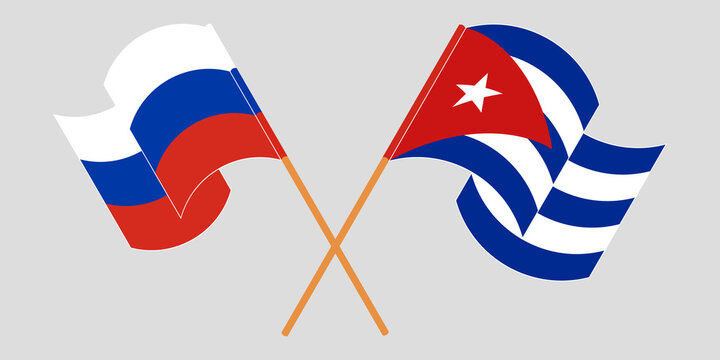 Crossed and waving flags of Cuba and Russia
