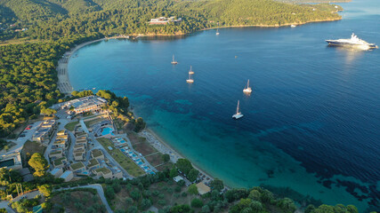 Fototapeta premium Aerial drone photo of beautiful popular organised sandy bay, turquoise beach and natural preserve lake with pine trees of Koukounaries, Skiathos island, Sporades, Greece