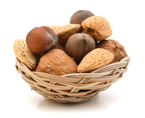 Mixed nuts selection of Brazil,almonds,waln ut and hazelnuts in basket on white