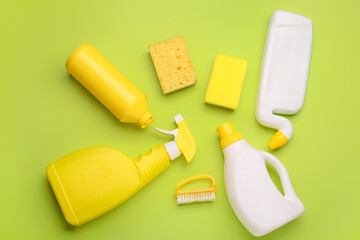 Set of cleaning supplies on color background