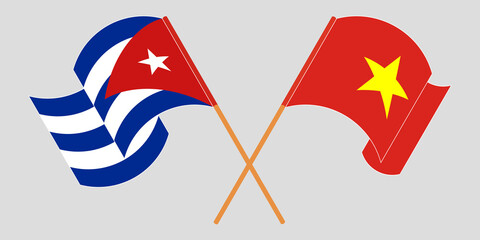 Crossed and waving flags of Cuba and Vietnam