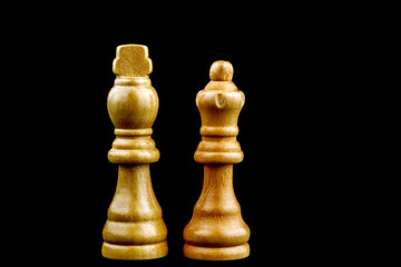 King and Queen Chess Pieces Isolated on a Black Background