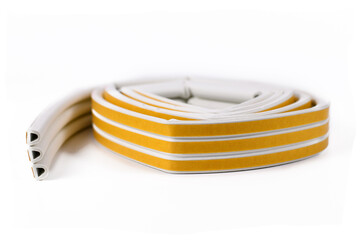 Rubber sealing tape for insulation of doors and windows isolated on white background