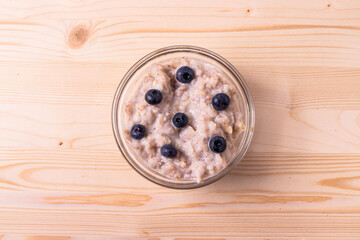 Obraz na płótnie Canvas blueberries and porridge as morning healthy breakfast concept