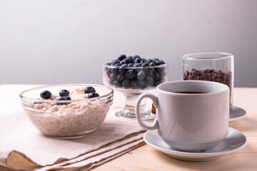 blueberries and porridge as morning healthy breakfast concept
