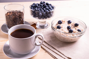 blueberries and porridge as morning healthy breakfast concept
