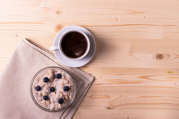 blueberries and porridge as morning healthy breakfast concept