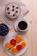 blueberries and porridge as morning healthy breakfast concept