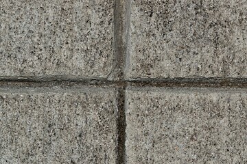 Concrete pavement macro with intersecting lines in the middle. Dry cement full frame background image.