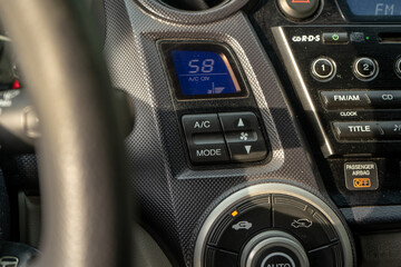 use air conditioner in car, climate control dashboard, switching temperature in vehicle